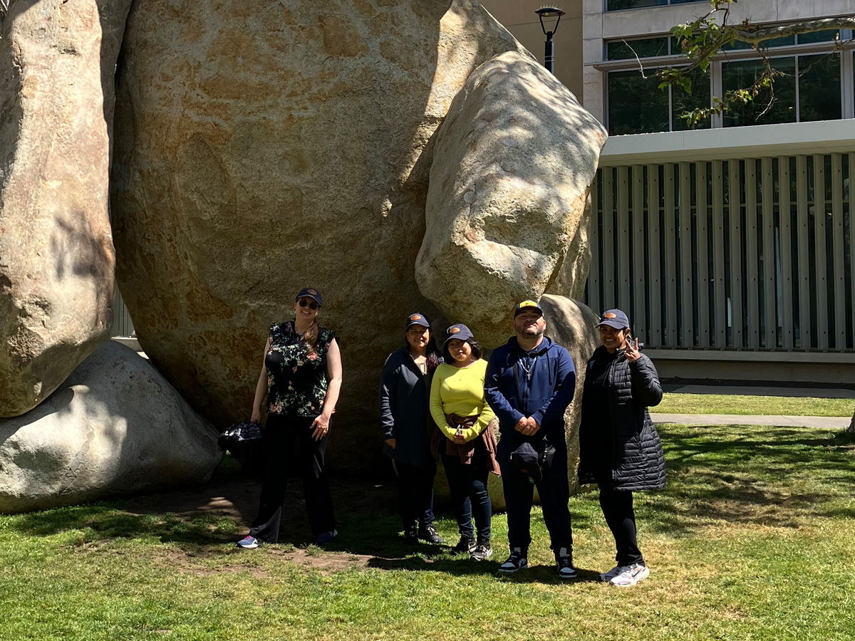 A photo of April hires in front of The Bear