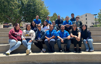 staff in cross training program in group photo on steps